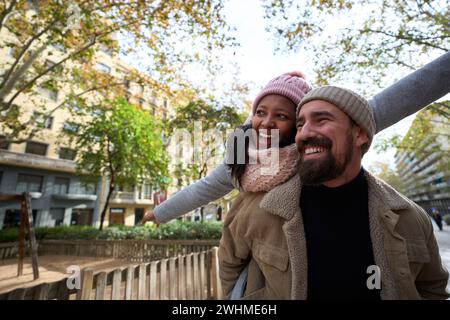 Close-up portrait of beautiful multiracial happy couple outdoor, young woman and man in love Stock Photo