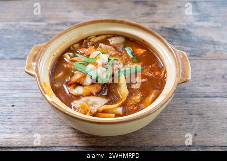 Kimchi Udon with shrimp and pork in kimchi soup Stock Photo