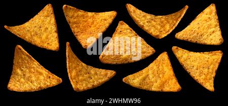 Falling corn chips, hot Mexican nachos isolated on black background Stock Photo