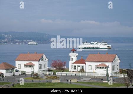 Mukilteo, WA, USA - February 7, 2024; Mukilteo lighthouse and building with car ferry MV Issaquah Stock Photo