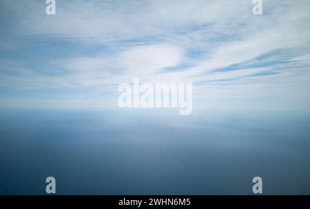 Cloudscape from above. blue sky cumulus clouds. Earth from above. Nature background Stock Photo
