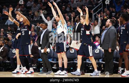 Washington DC, USA. 10th Feb, 2024. Connecticut Huskies players celebrate during a match between the Georgetown Hoyas and the Connecticut Huskies at Capital One Arena in Washington DC. Daniel Kucin Jr./Cal Sport Media/Alamy Live News Stock Photo