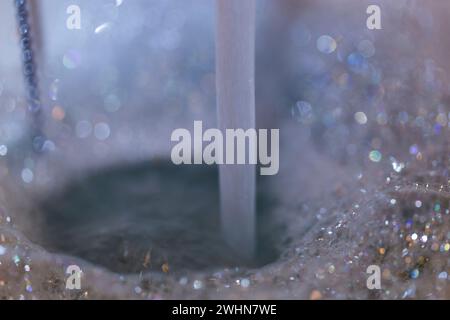 Water Spout and bubbles background.Bath running Stock Photo