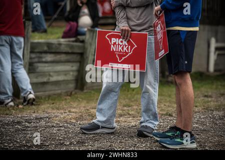 Gilbert, South Carolina - February 10, 2024: Nikki Haley supporters hold signs during her 'Beast of The Southeast' campaign bus tour. Stock Photo