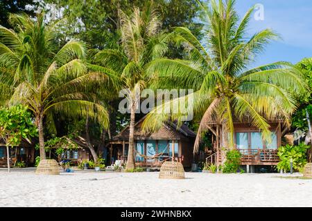 Bamboo hut bungalows on the beach in Thailand Stock Photo