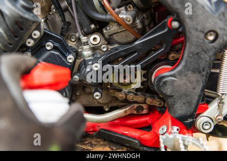 Lubricating motorcycle chain Stock Photo