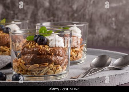 Glass cups of chocolate and chestnuts mousse Stock Photo