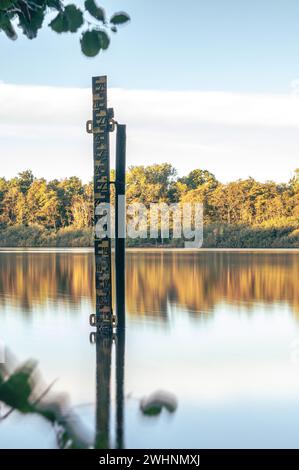 Water level indicator in lake in Germany Stock Photo