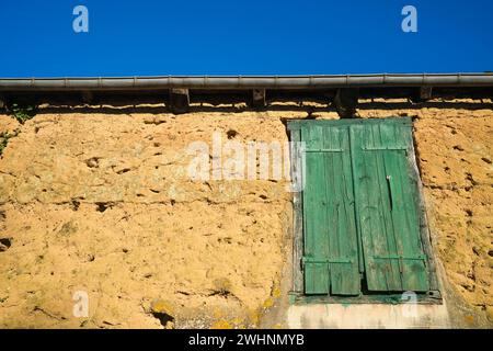 Rustic rural closed old timber window shutter Stock Photo