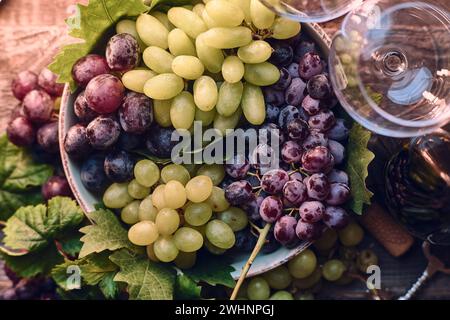 Grapes in a bowl on wooden table Stock Photo