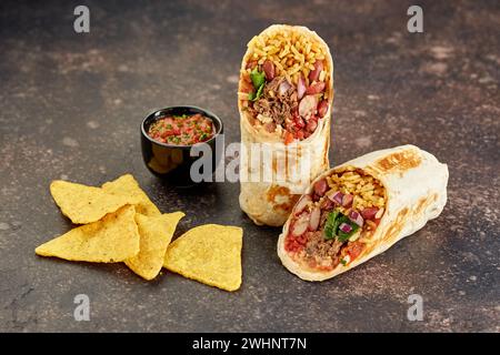 Traditional Mexican Beef Burrito with Nachos Chips and Salsa Sauce Stock Photo