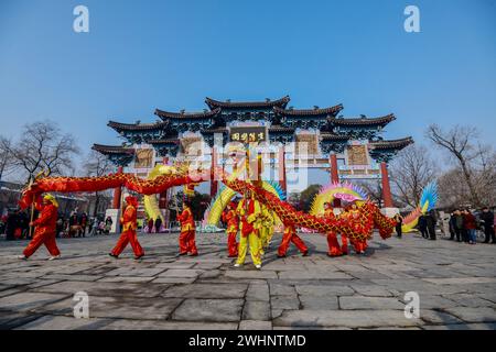Fuyang, China. 10th Feb, 2024. Folk performers perform a dragon dance at the square, an important traditional performance in China to celebrate the Chinese New Year, the Spring Festival. Credit: SOPA Images Limited/Alamy Live News Stock Photo