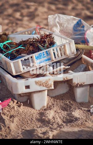 Littered trash at sand beach Stock Photo
