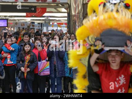 Richmond, Canada. 10th Feb, 2024. People watch a lion dance performance at a shopping mall to celebrate the Chinese Lunar New Year in Richmond, British Columbia, Canada, on Feb. 10, 2024. Credit: Liang Sen/Xinhua/Alamy Live News Stock Photo