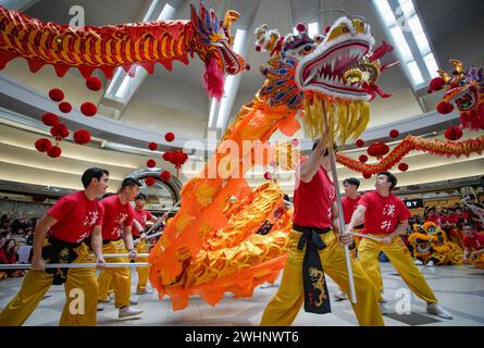 Richmond, Canada. 10th Feb, 2024. People watch a dragon dance performance at a shopping mall to celebrate the Chinese Lunar New Year in Richmond, British Columbia, Canada, on Feb. 10, 2024. Credit: Liang Sen/Xinhua/Alamy Live News Stock Photo
