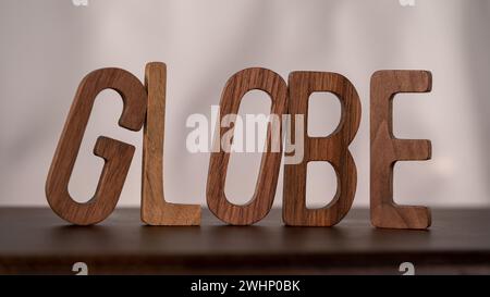 Natural Typography: Wooden 3D Letters Spell 'Global' on Table Stock Photo