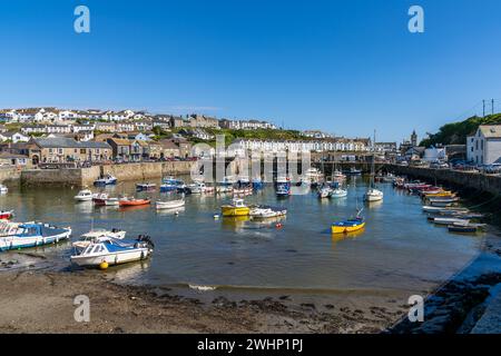 Porthleven, Cornwall, England, UK - June 02, 2022: Ships in the harbour on a clear day Stock Photo