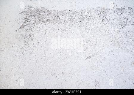 Plastered wall surface with rubbed off white paint, light gray background texture for urban themes or architecture, full frame, Stock Photo
