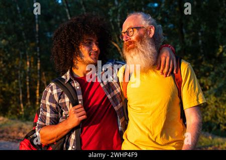 Generations United: Father-Son Bond in Nature Stock Photo