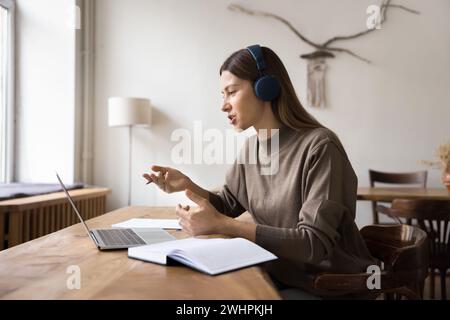 Positive manager woman talking to client on video call Stock Photo