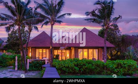 Modern house with a swimming pool, modern pool villa at the beach, luxury villa Stock Photo