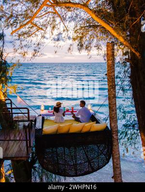 Romantic dinner on the beach in Koh Kood Thailand, couple having dinner on the beach during vacation Stock Photo