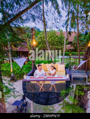 Romantic dinner on the beach in Koh Kood Thailand, couple having dinner on the beach during vacation Stock Photo