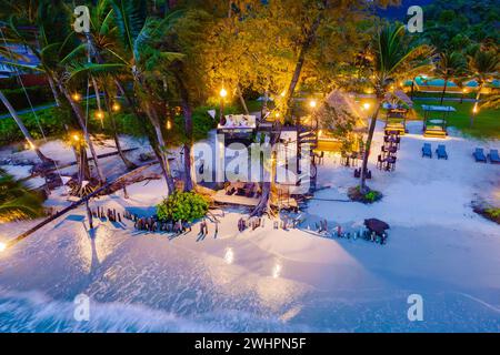 Romantic dinner on the beach in Koh Kood Thailand, couple having dinner on the beach during vacation Stock Photo