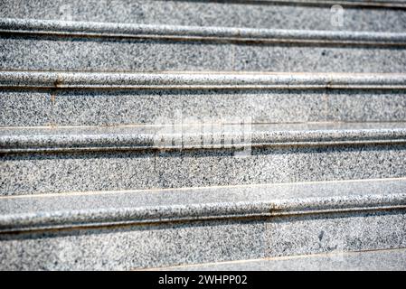 Steps of an empty stone granite staircase close up Stock Photo