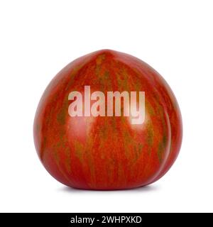 Red with green striped black zebra tomato, isolated on a white background. Stock Photo