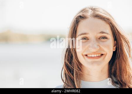 Captivating Millennial Beauty: Brown-Eyed Charmer in Natural Setting Stock Photo