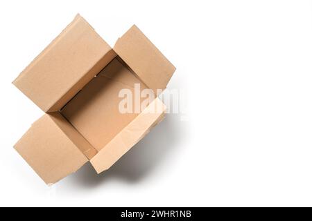 Open empty cardbord box package for delivering and transport on a white background, high angel view from above, copy space Stock Photo