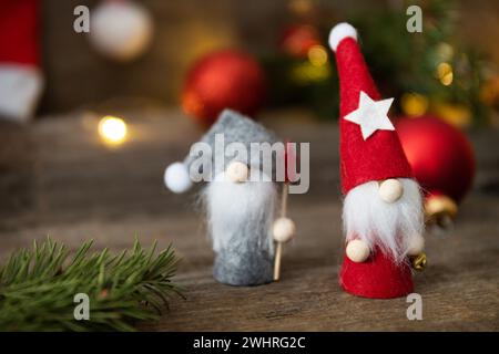 Vintage Christmas postcard design. Christmas gnomes with fir tree, christmas lights and red christmas baubles decorations. Copy Stock Photo