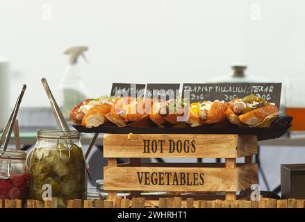 A booth with fresh hot dogs on display at the street food farmers market. in Prague, Czech. Stock Photo
