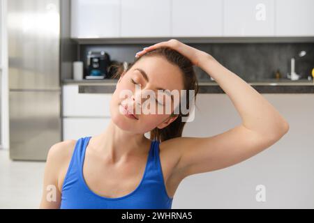 Close-up Potrait Of Fitness Woman, Does Training, Workout From Home 