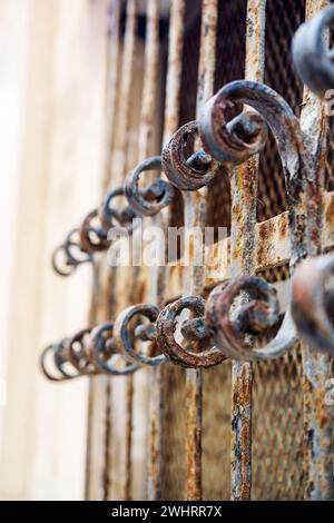 Window with decorated bars made of forged iron Stock Photo - Alamy