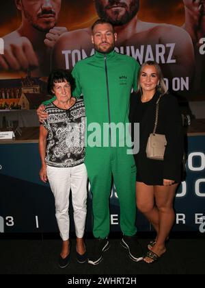 Boxer Tom Schwarz from the Magdeburg boxing stable Fides Sports with his wife Frederike and grandma Elli at the press conference Stock Photo