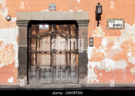 Antigua, Guatemala.  Doorway, Sidewalk, Person Walking. Stock Photo