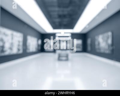 Blurred perspective photo scene of art exhibition at gallery or museum with paintings or artist works, room decoration. Abstract blur background of da Stock Photo