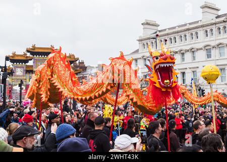 Close up of the beautifully decorated dragon performing its traditional Chinese New Year dragon dance in Liverpool seen on 11 February 2024 in front o Stock Photo