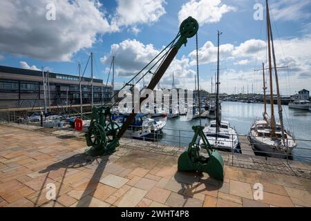 Old machinery in the historic Victoria Dock area of Caernarfon on the coast of North Wales. Stock Photo