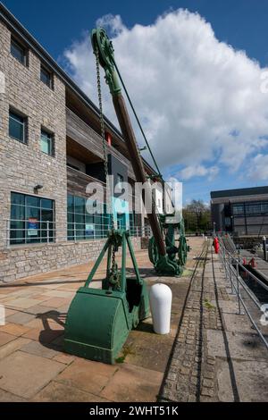 Old machinery in the historic Victoria Dock area of Caernarfon on the coast of North Wales. Stock Photo