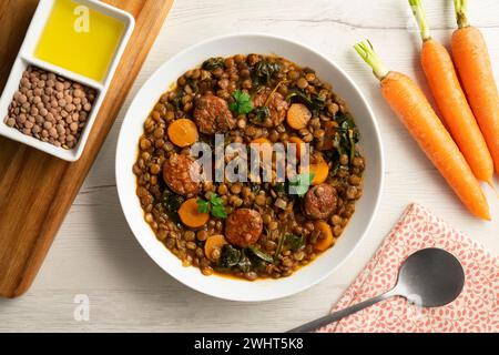 Lentil stew with chorizo and carrot. Traditional Spanish recipe. Stock Photo