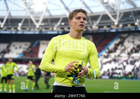 Arsenal's Martin Odegaard celebrates after the final whistle in the Premier League match at the London Stadium. Picture date: Sunday February 11, 2024. Stock Photo