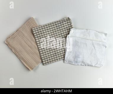 Napkins and towels on white background. Kitchen textiles, top view Stock Photo