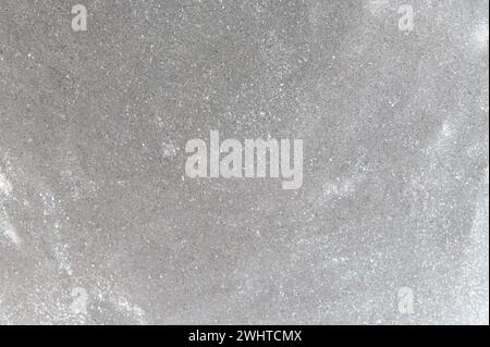 Shiny glittery silver color slime background close up view Stock Photo
