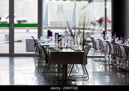 Indoor restaurant tables ready for service Stock Photo