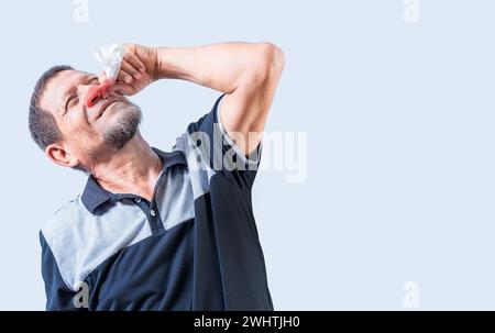 Senior man with irritated nose isolated. man with red nose cold, Concept of sinusitis. Person with nasal congestion Stock Photo