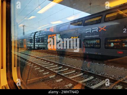 View from a train onto a double-decker regional train operated by National Express, Duesseldorf, North Rhine-Westphalia, Germany Stock Photo