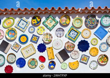 Traditional portuguese pottery plates on a wall in Algarve Stock Photo
